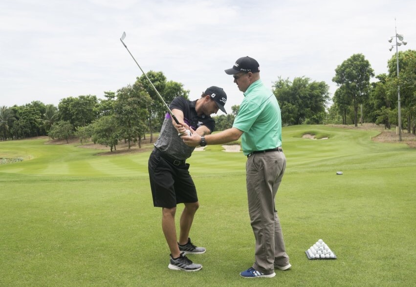 Vderberg Golf with a client having a lesson on a London golf course.