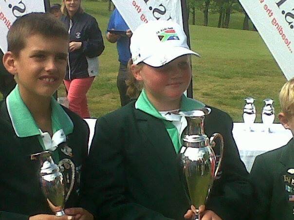 Young golfers accepting their trophies